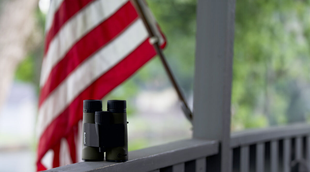 American flag with binoulars